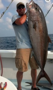 Fisherman Holding a large Amberjack