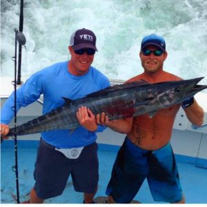 2 men on spring break with their catch
